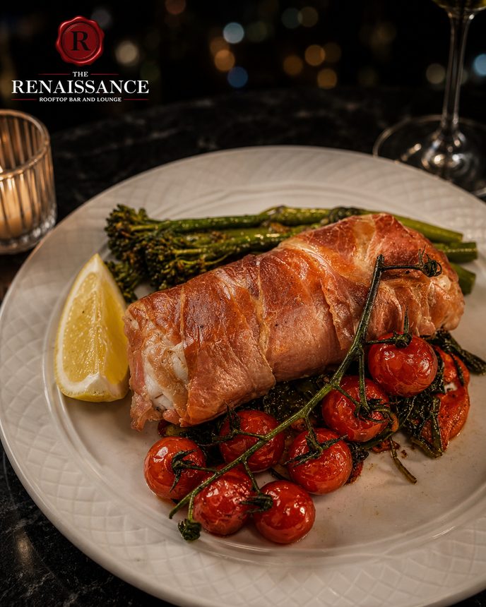 Prosciutto-wrapped salmon with blistered tomatoes and broccolini
